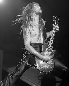 Black and white photo of Zakk Wylde playing a Les Paul Standard in concert in 1989 by Marty Temme