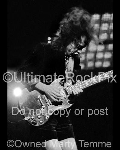 Black and White Photos of Angus Young of AC/DC Playing a Gibson SG in Concert by Marty Temme