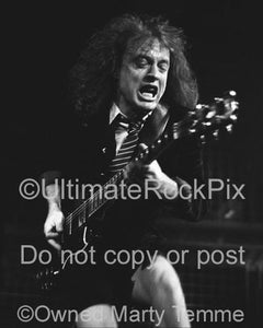 Black and White Photos of Angus Young of AC/DC Playing a Gibson SG by Marty Temme
