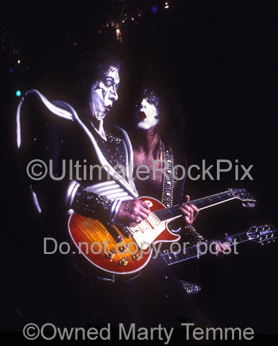 Photo of Ace Frehley and Paul Stanley of Kiss in concert by Marty Temme
