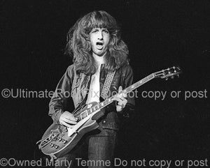 Photos of guitarist Brad Whitford of Aerosmith playing a Gibson Les Paul in concert in 1974 by Marty Temme