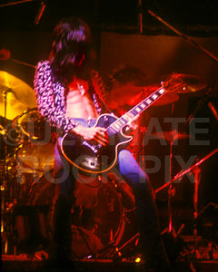 Photo of Joe Perry of Aerosmith in concert in 1975 by Marty Temme