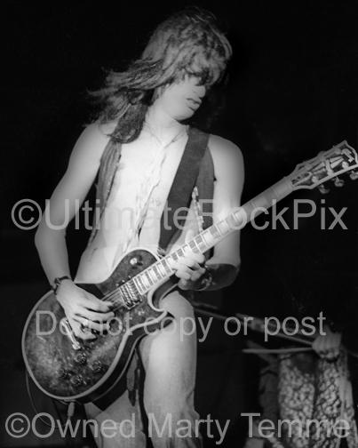 Photo of guitar player Joe Perry of Aerosmith in concert in 1974 by Marty Temme