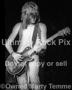 Black and white photo of Joe Perry of Aerosmith in concert in 1974 by Marty Temme