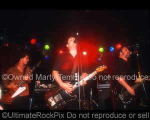 Photo of Rick McCollum, Greg Dulli and John Curley of The Afghan Whigs in concert in 1999 by Marty Temme