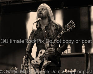 Sepia tint photos of Jerry Cantrell of Alice in Chains Playing a Gibson Les Paul Guitar in Concert in 2010 by Marty Temme