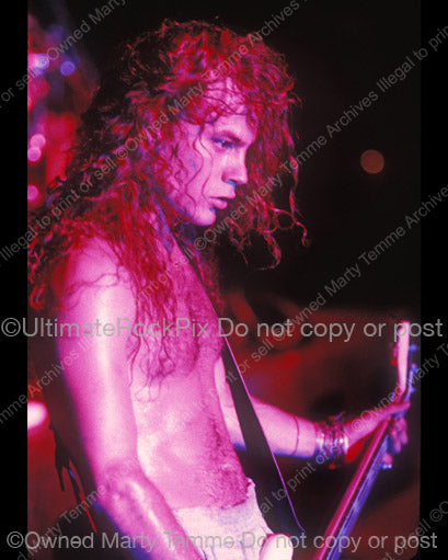 Photo of Mike Starr of Alice in Chains in concert in 1991 by Marty Temme