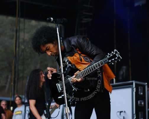 Photo of William DuVall of Alice in Chains playing guitar in concert in 2007 by Marty Temme
