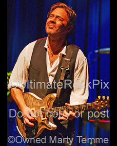 Photo of guitar player Al Di Meola in concert in 2006 by Marty Temme