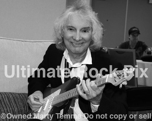 Black and white photo of guitarist Albert Lee backstage in 2012 by Marty Temme