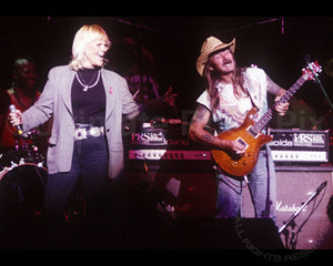 Photo of Bonnie Bramlett and Dickey Betts of The Allman Brothers in concert in 1994 by Marty Temme