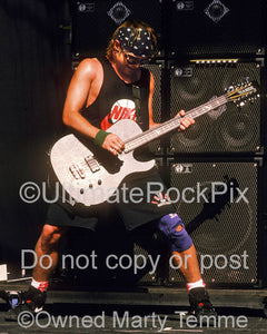Photo of bass player Jeff Ament of Pearl Jam in concert in 1992 by Marty Temme