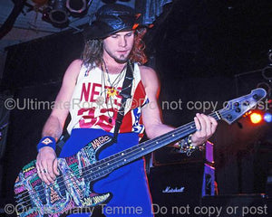 Photo of bass player Jeff Ament of Pearl Jam in concert in 1991 by Marty Temme