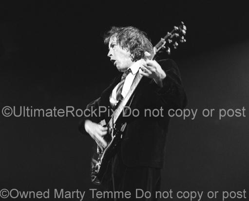 Photos of Angus Young of AC/DC Playing a Gibson SG by Marty Temme