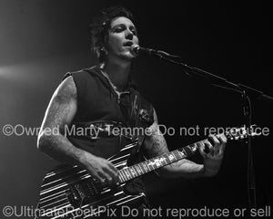Black and white photo of guitar player Synyster Gates of Avenged Sevenfold in concert by Marty Temme