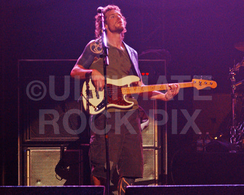 Photo of bass player Tim Commerford of Audioslave in concert by Marty Temme