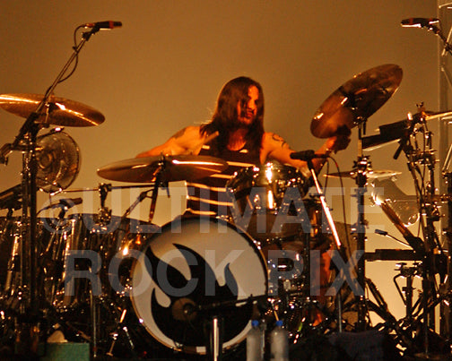 Photo of drummer Brad Wilk of Audioslave in concert in 2006 by Marty Temme