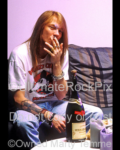 Photo of Axl Rose of Guns N' Roses during a photo shoot in 1990 at his home in Hollywood, California by Marty Temme