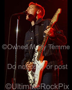 Photo of Bryan Adams singing in concert by Marty Temme