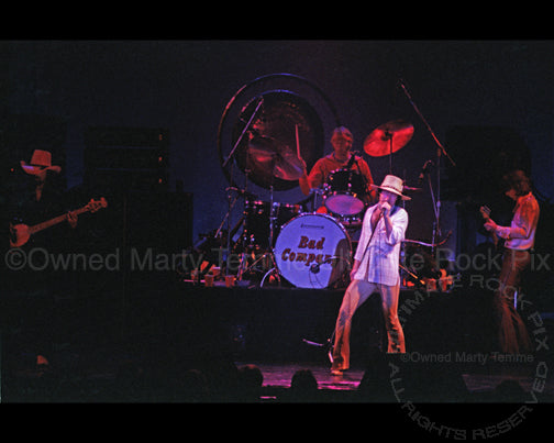 Photo of Paul Rodgers and Bad Company in concert in 1977 by Marty Temme