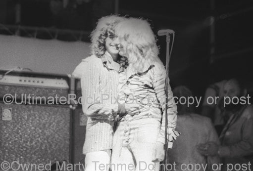 Photo of Mick Ralphs and Jimmy Page playing together in concert in 1974 by Marty Temme