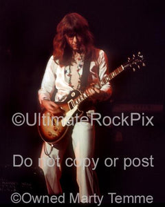 Photo of Mick Ralphs of Bad Company playing a Gibson Les Paul in concert in 1975 by Marty Temme