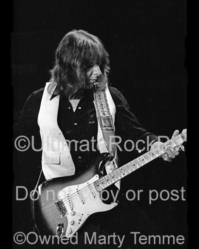 Black and White Photo of Mick Ralphs of Bad Company Playing a Fender Stratocaster in Concert in 1979 by Marty Temme