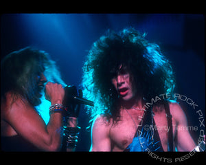 Photo of Marq Torien and Mick Sweda of BulletBoys in concert in 1989 by Marty Temme 