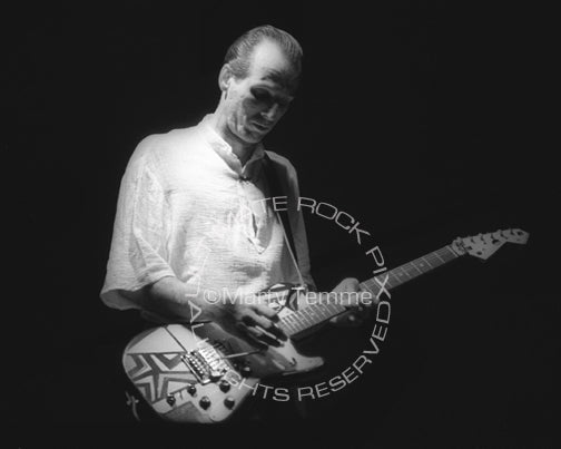 Photo of Adrian Belew of King Crimson in concert in 1984 by Marty Temme