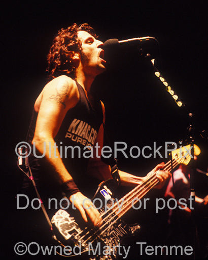 Photo of Frank Bello of Anthrax in concert in 1991 by Marty Temme