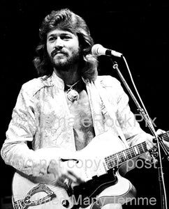 Photo of Barry Gibb of The Bee Gees in concert in 1979 by Marty Temme