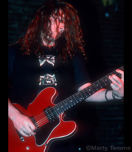 Photo of Tim Mosher of Broken Glass in concert in 1990 by Marty Temme
