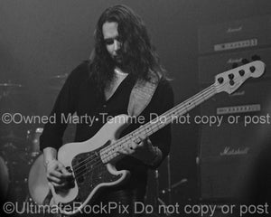 Photo of bass player Bjorn Englen of Yngwie Malmsteen in concert in 2008 by Marty Temme