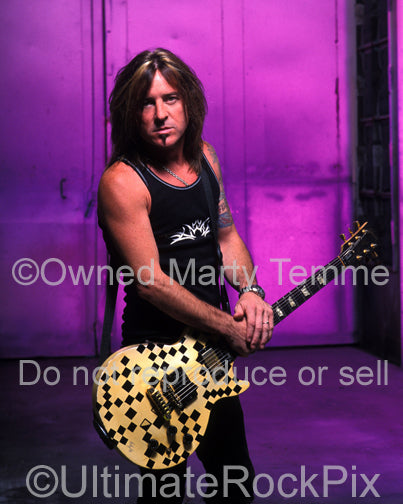 Photo of guitarist Jeff Bland of Slaughter during a photo shoot in 2003 by Marty Temme