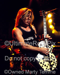 Photo of guitarist Jeff "Blando" Bland of Slaughter in concert in 2003 by Marty Temme
