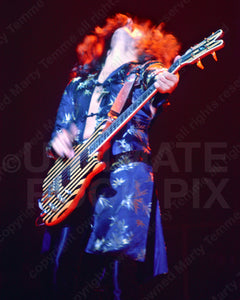 Photo of Geezer Butler of Black Sabbath in concert in 1978 by Marty Temme