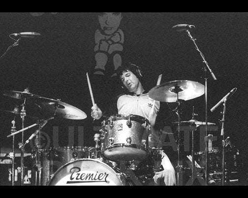 Photo of Clem Burke of Blondie playing drums in concert by Marty Temme
