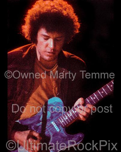 Photo of guitar player Mike Bloomfield of The Electric Flag playing a Fender Telecaster in concert in 1973 by Marty Temme