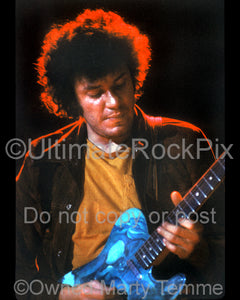 Photo of guitarist Mike Bloomfield playing a Telecaster in concert in 1973 by Marty Temme