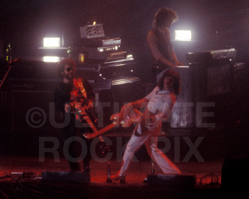 Photo of Buck Dharma and Eric Bloom of Blue Oyster Cult in concert in 1977 by Marty Temme