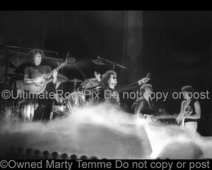 Photo of Allen Lanier and Buck Dharma of Blue Oyster Cult in concert in 1974 by Marty Temme