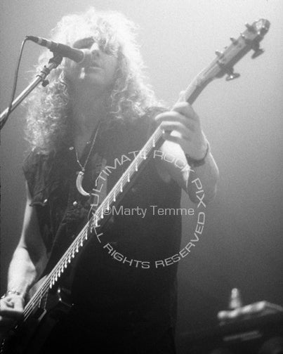 Photo of bassist John Smithson of Bonham in concert in 1992 by Marty Temme