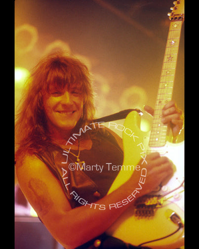 Photo of Richie Sambora of Bon Jovi playing a Stratocaster in concert in 1992 by Marty Temme