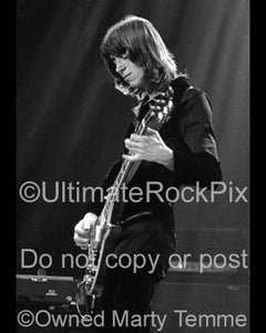 Black and white photo of Tom Scholz of Boston playing a Les Paul in 1979 by Marty Temme