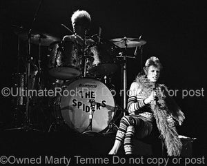 Black and white photo of David Bowie and Woody Woodmansey in concert in 1973 by Marty Temme