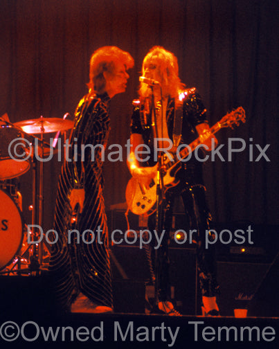 Photo of David Bowie and Mick Ronson performing onstage in 1973 by Marty Temme