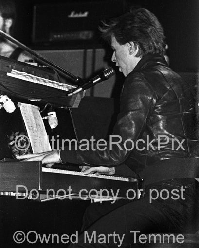 Photo of David Bowie playing keyboards with Iggy Pop in 1977 by Marty Temme