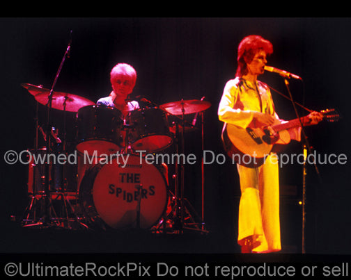Photo of David Bowie and Woody Woodmansey onstage in 1973 by Marty Temme