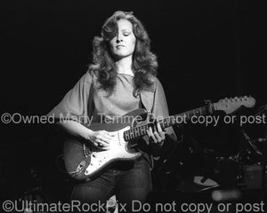 Black and White Photo of Guitarist Bonnie Raitt Playing Slide on Her Fender Stratocaster in Concert in 1980 by Marty Temme