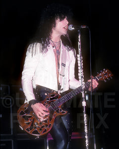 Photo of Dean Davidson of Britny Fox playing a Les Paul Junior in concert in 1989 by Marty Temme